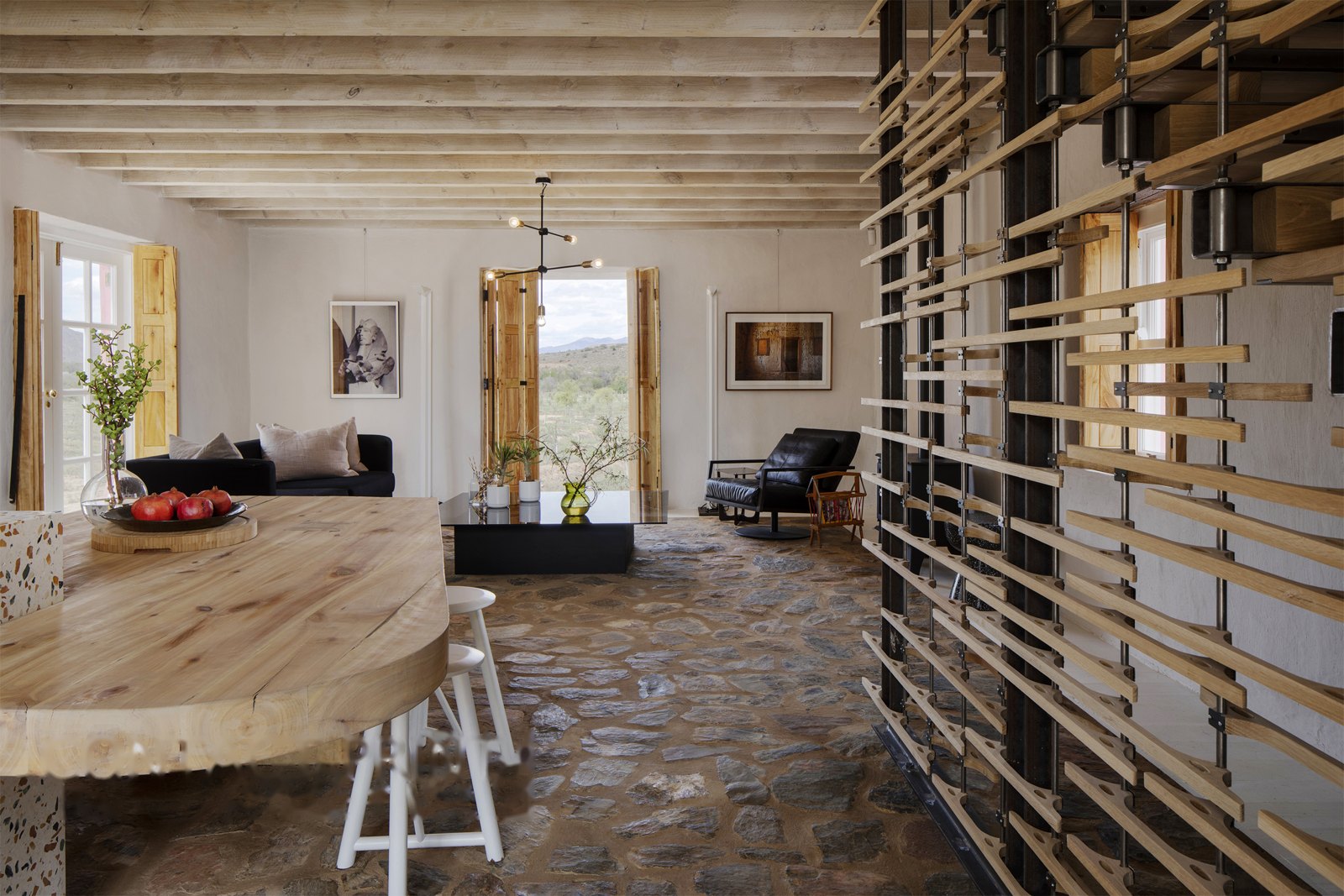 Folded-plate and waterjet-oak staircase — screen seen across the living room