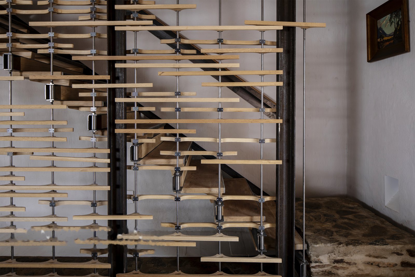Folded-plate and waterjet-oak staircase — oak treads on steel rod, Buffelsdrift