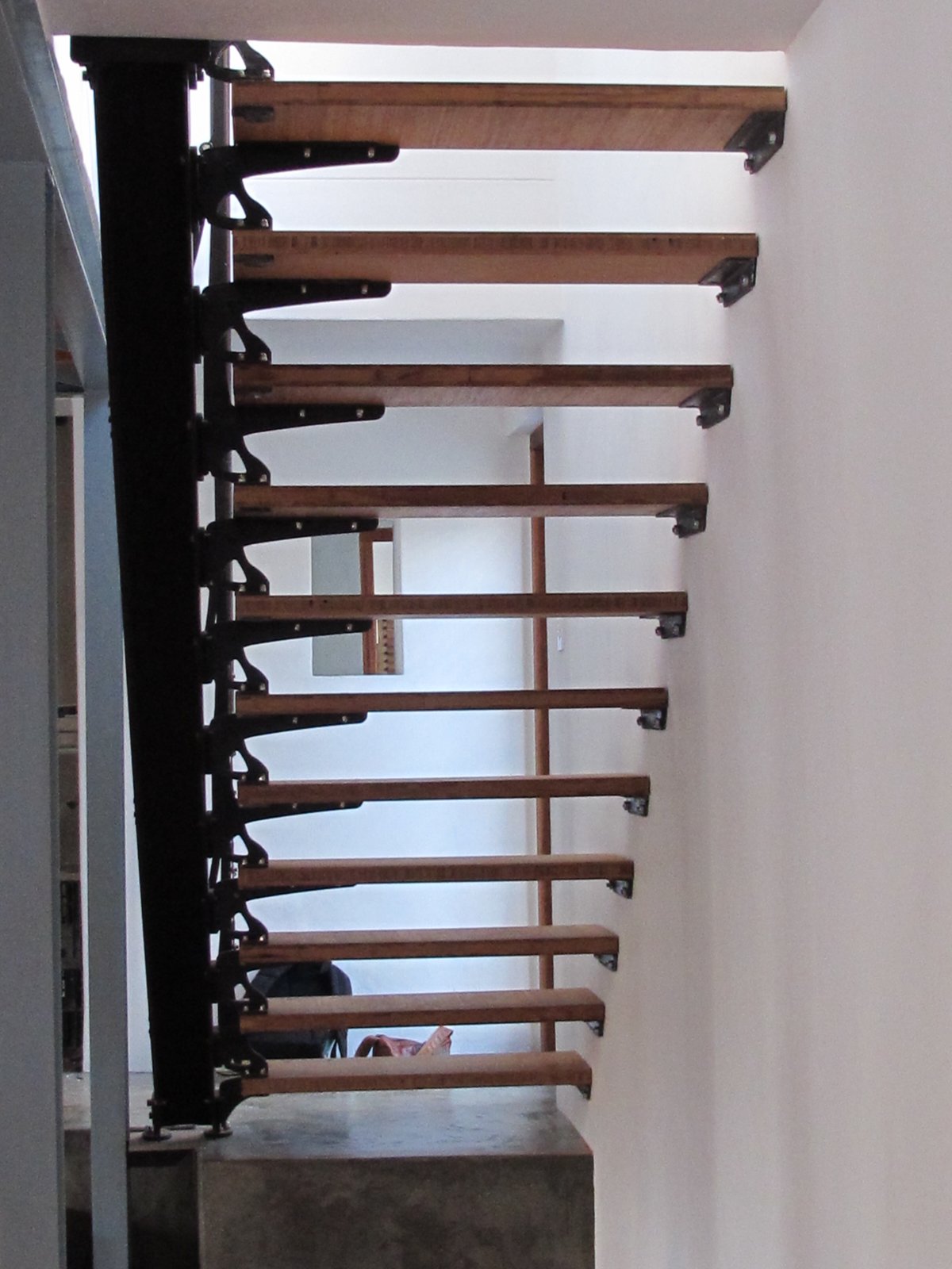 Bamboo plywood and steel staircase — full flight up to the mezzanine, House du Plessis
