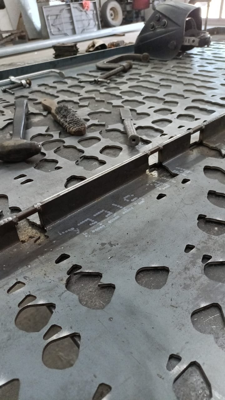 Geyser screen — plate on the cutting bed, perforations laser-cut